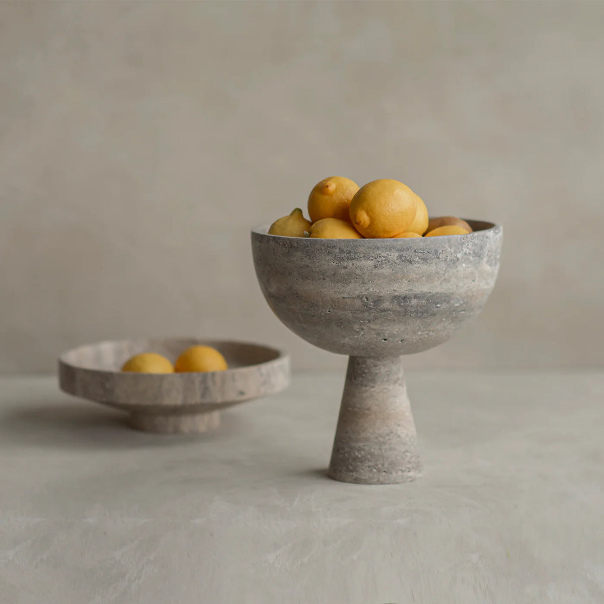 Silver travertin pedestal bowl